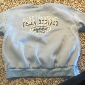 -Light blue crew neck, brand is SHEIN, size medium